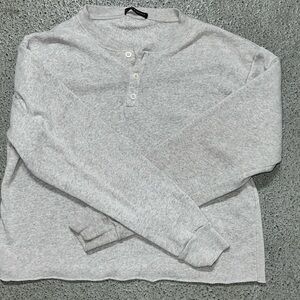 White long sleeve Brandy Melville shirt.